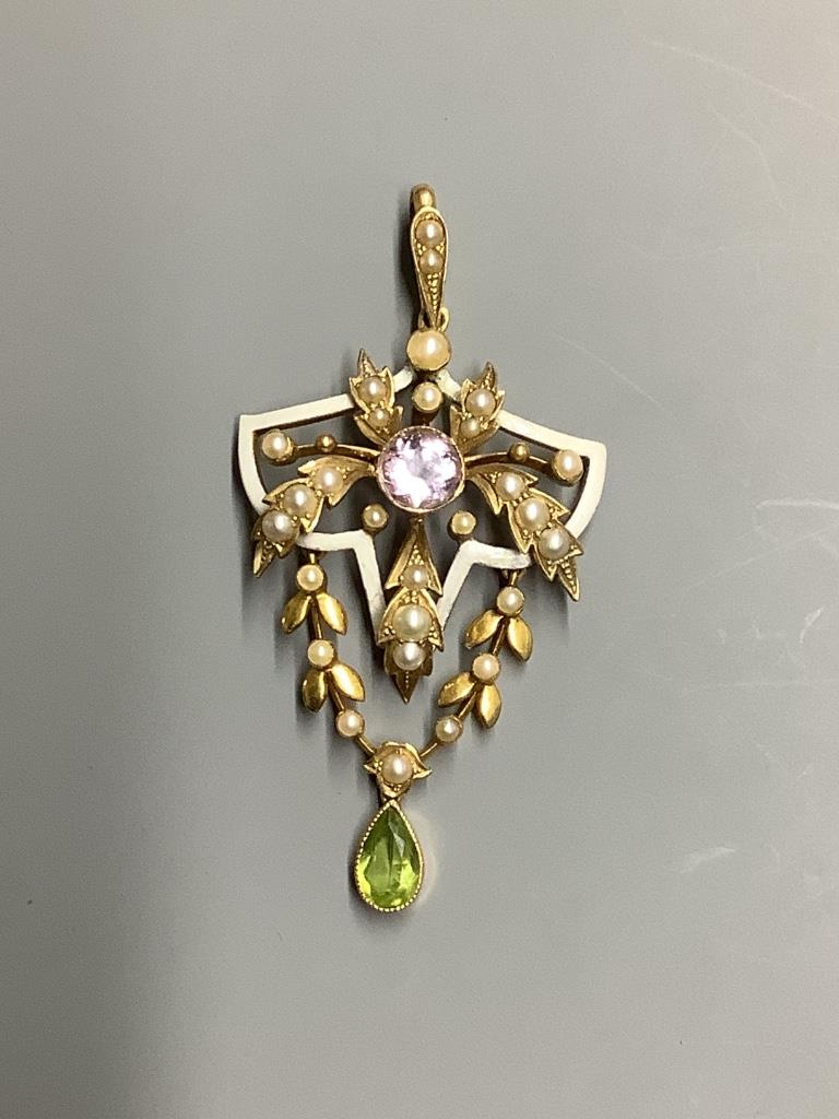 An Edwardian yellow metal stamped 15, amethyst, peridot seed pearl and white enamel set drop pendant, in the suffragette colours